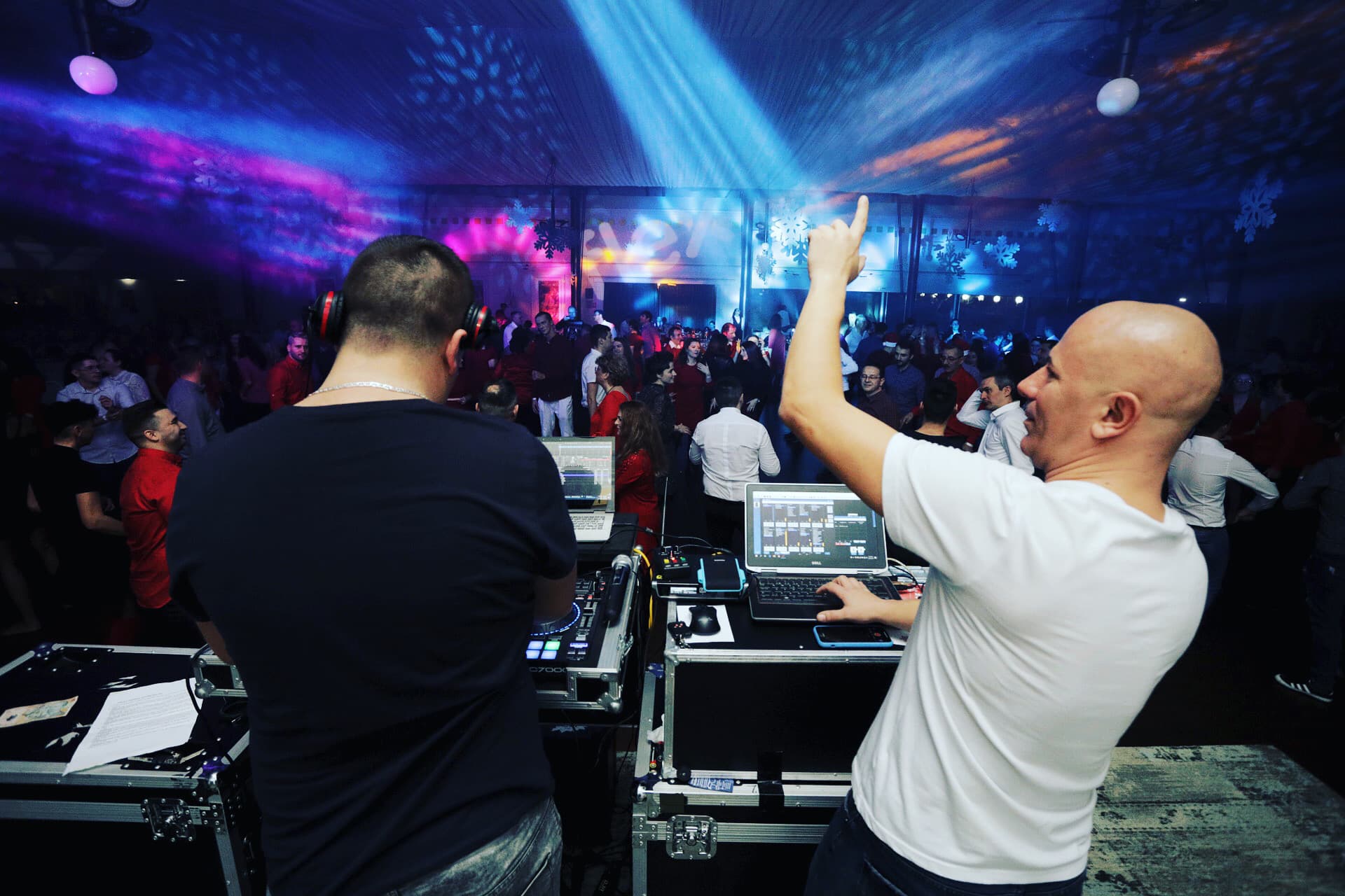 DJ Alex Bedeleu silhouette against golden sunset with Zante Party Management branded shirt